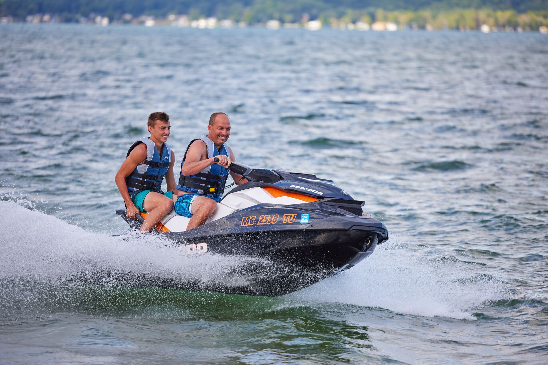 Two guys on a jet ski on the water, how to get a Florida jet ski license concept. 